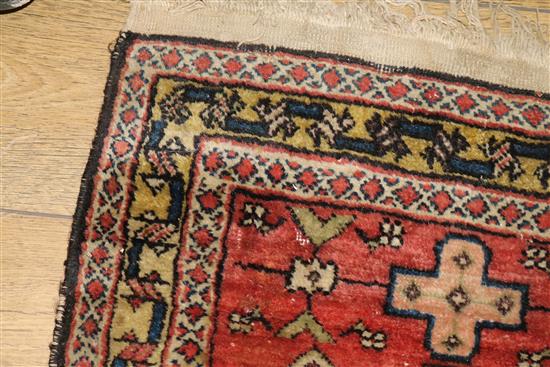 A Caucasian rug with triple medallion on a blue ground and two worn Persian rugs 210 x 120cm, 205 x 135cm and 195 x 145cm
